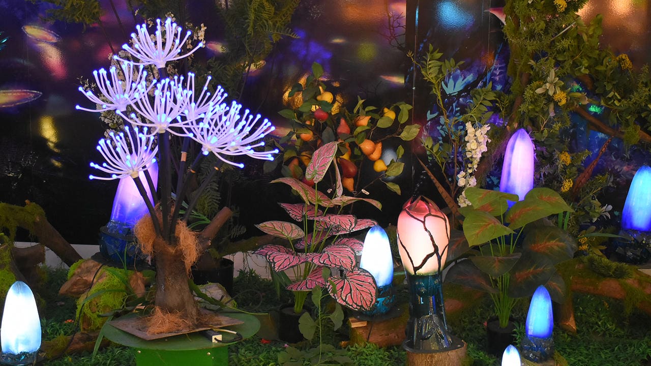 Glowing flower and plant forms in a dense fantasy garden display