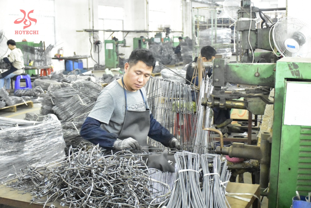 HOYECHI craftsman producing metal frame components for custom dragon lanterns in the factory